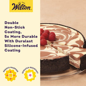 Wilton Platinum non-stick springform pan shown with cheesecake for flawless slices.