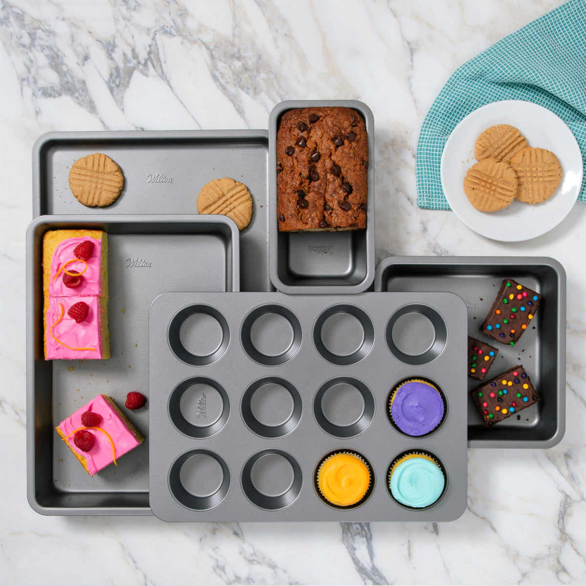 Wilton Silver Non Stick Large Baking Sheet shown as dishwasher-safe for easy cleanup.