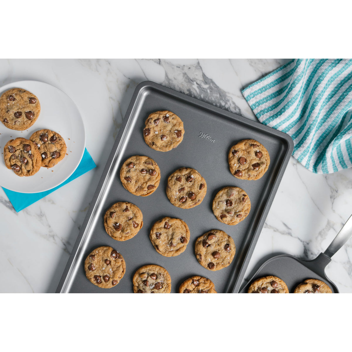 Wilton Silver Non Stick Large Baking Sheet with non-stick coating enables effortless release and quick cleanup.