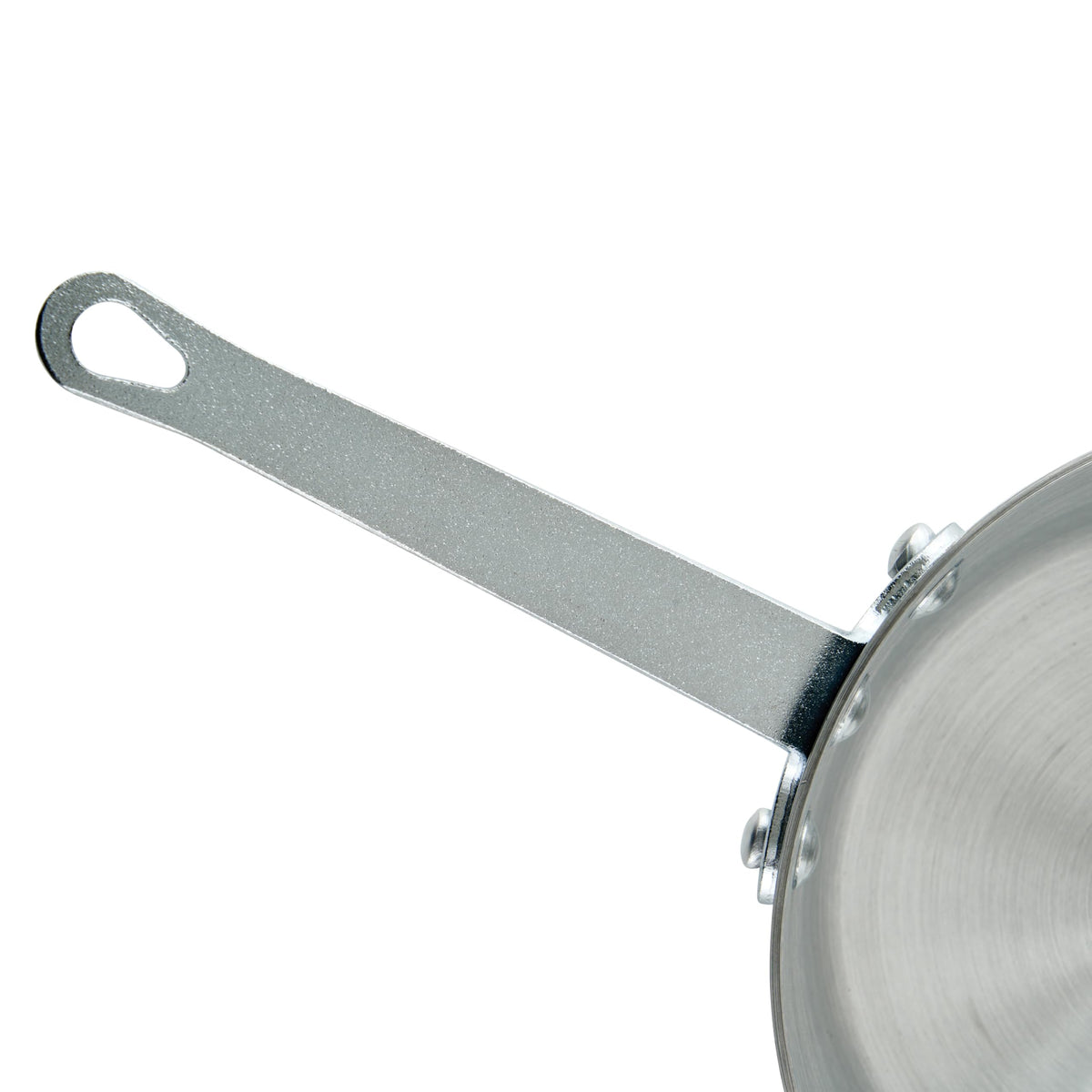 Winco pan on gas range demonstrating compatibility with heat source.