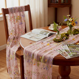 Windkream pink floral table runner on a long dining table for weddings.