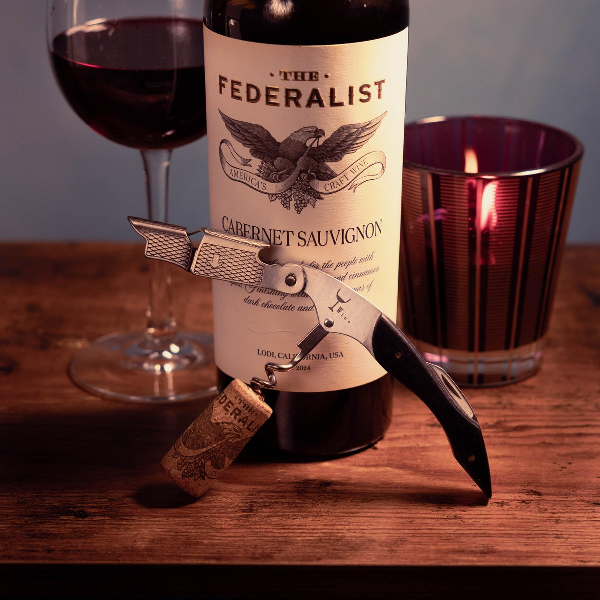Wino Wine Key open bottle in action with silent performance