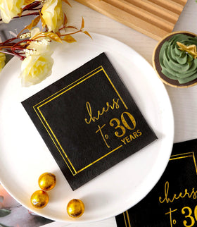 Close-up of black and gold foil design on Winoo napkins for elegant events