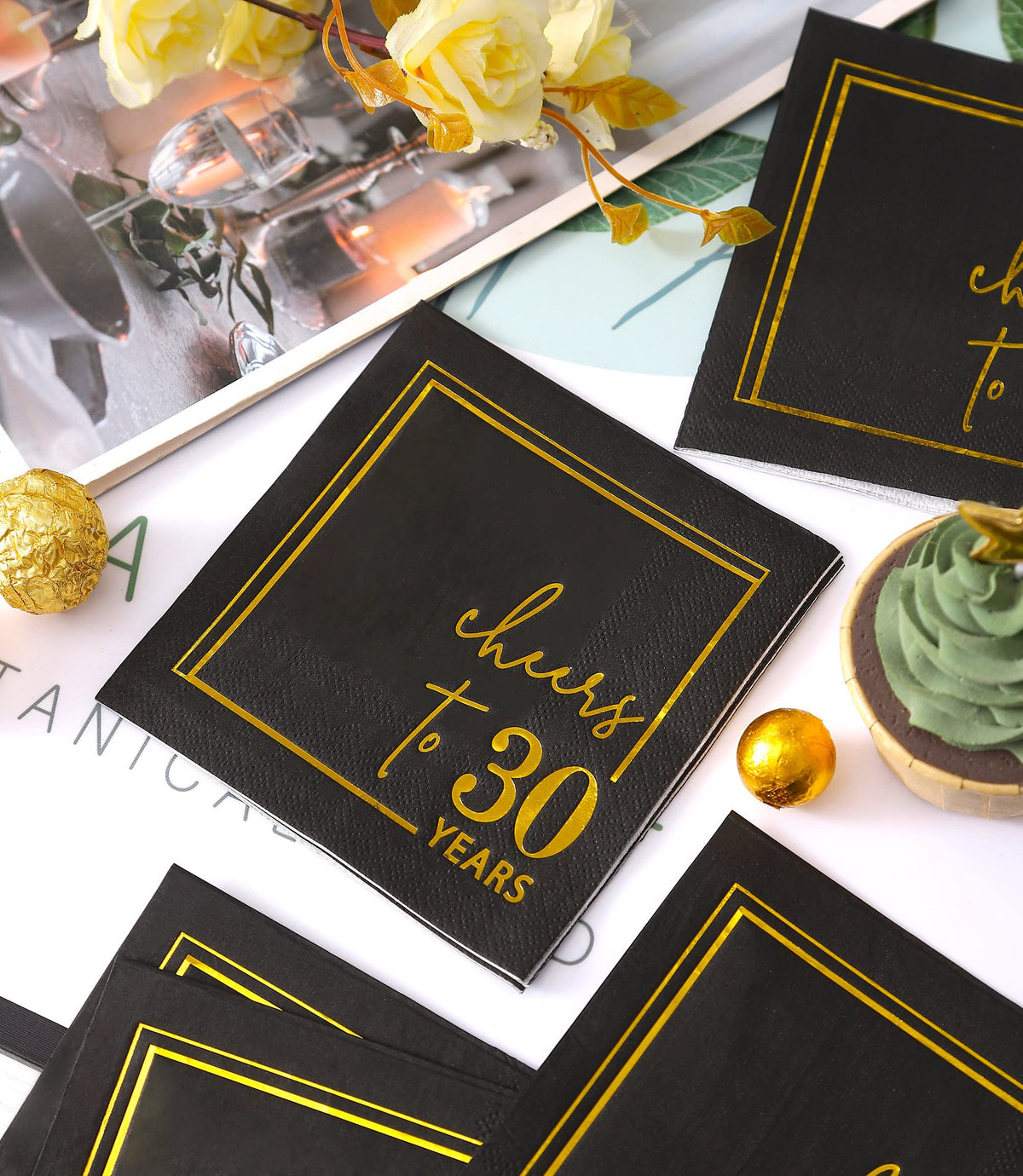 Packaging shot showing a 50-count Cheers to Years napkin pack by Winoo Design