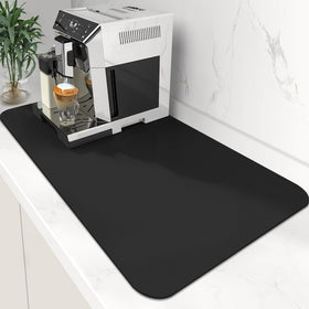 WISELIFE coffee mat under the coffee maker catching spills and stains.