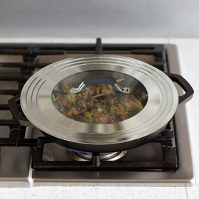 WishDirect universal lid demonstrating compatibility with 11-15 inch pans