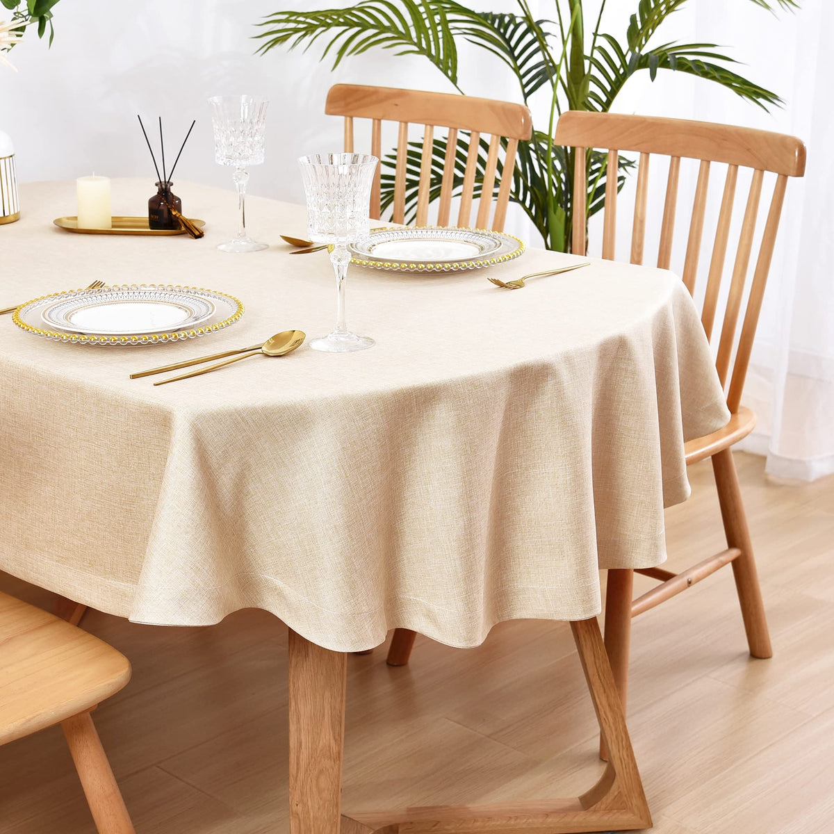 Wolkemer faux linen oval tablecloth 60x84 full view enhances table aesthetics.