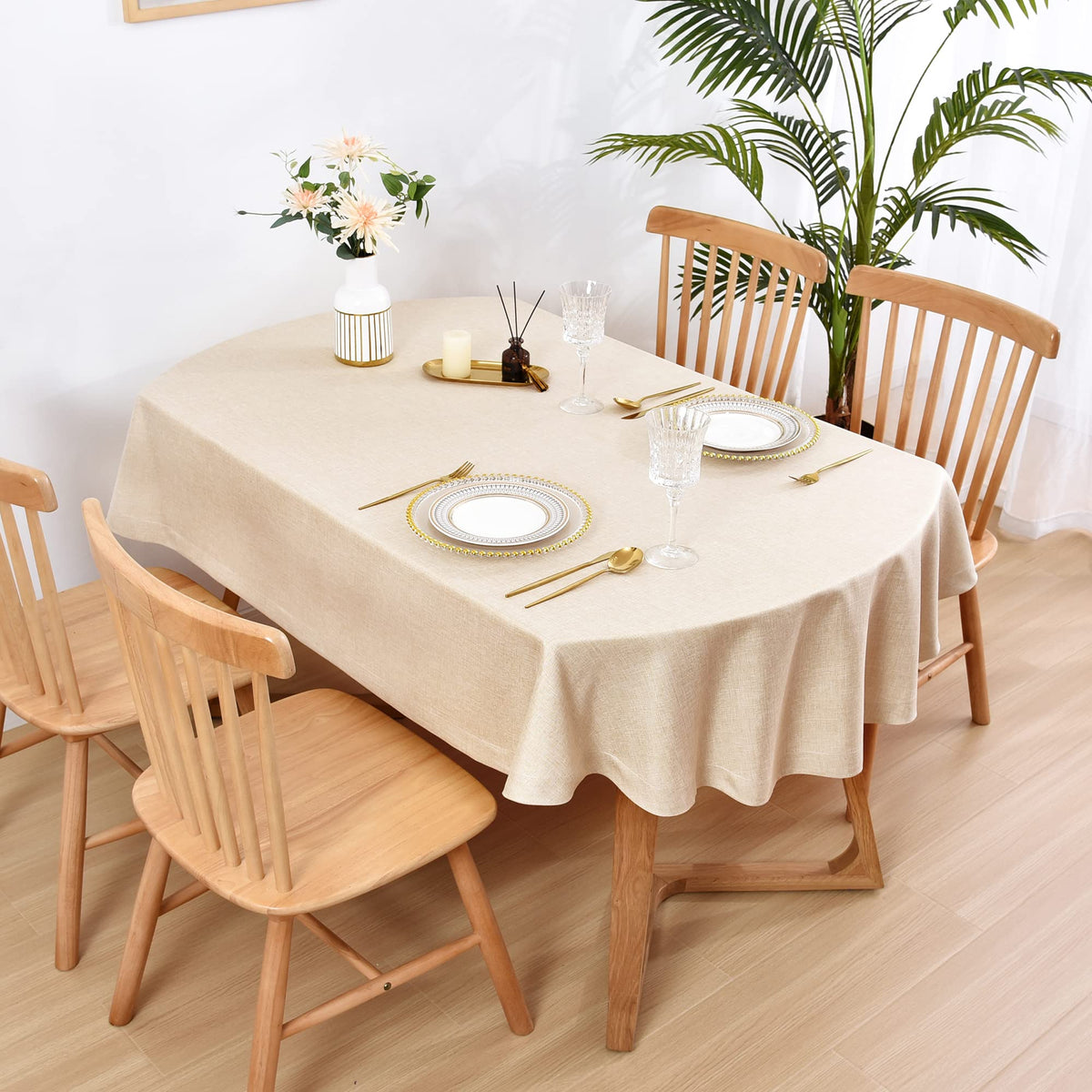 Wolkemer faux linen oval tablecloth on table demonstrates elegant drape.