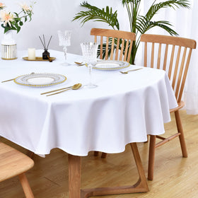 Wolkemer oval tablecloth 60x84 on table adds clean white elegance.