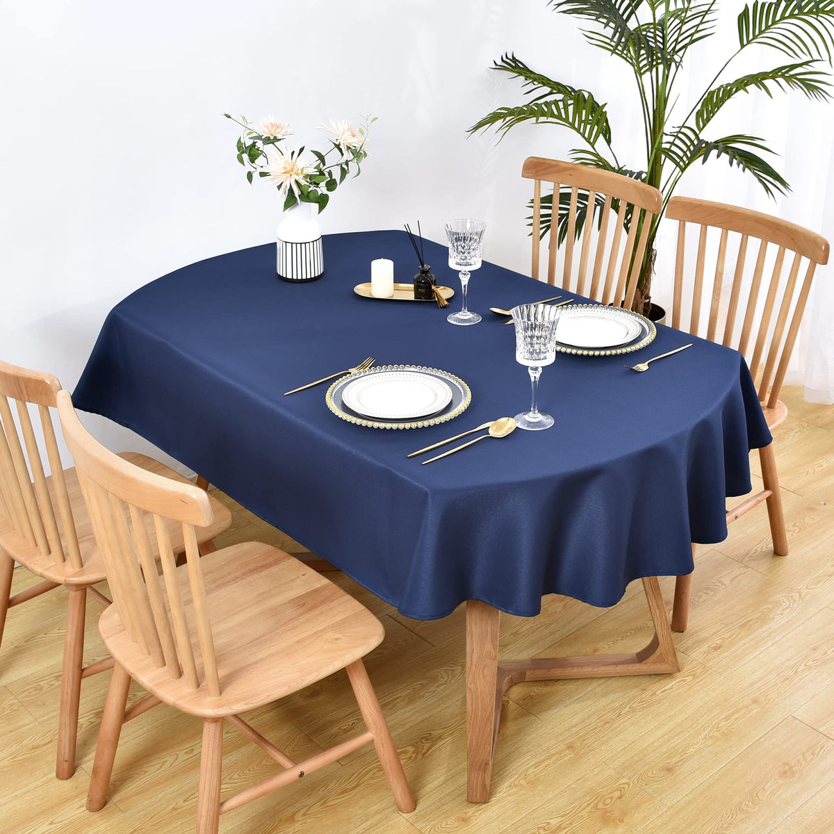 Wolkemer oval tablecloth navy outdoor setup enhancing a casual event with color and protection