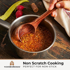 Woodenhouse teak ladle displays natural finish and warm wood tone.