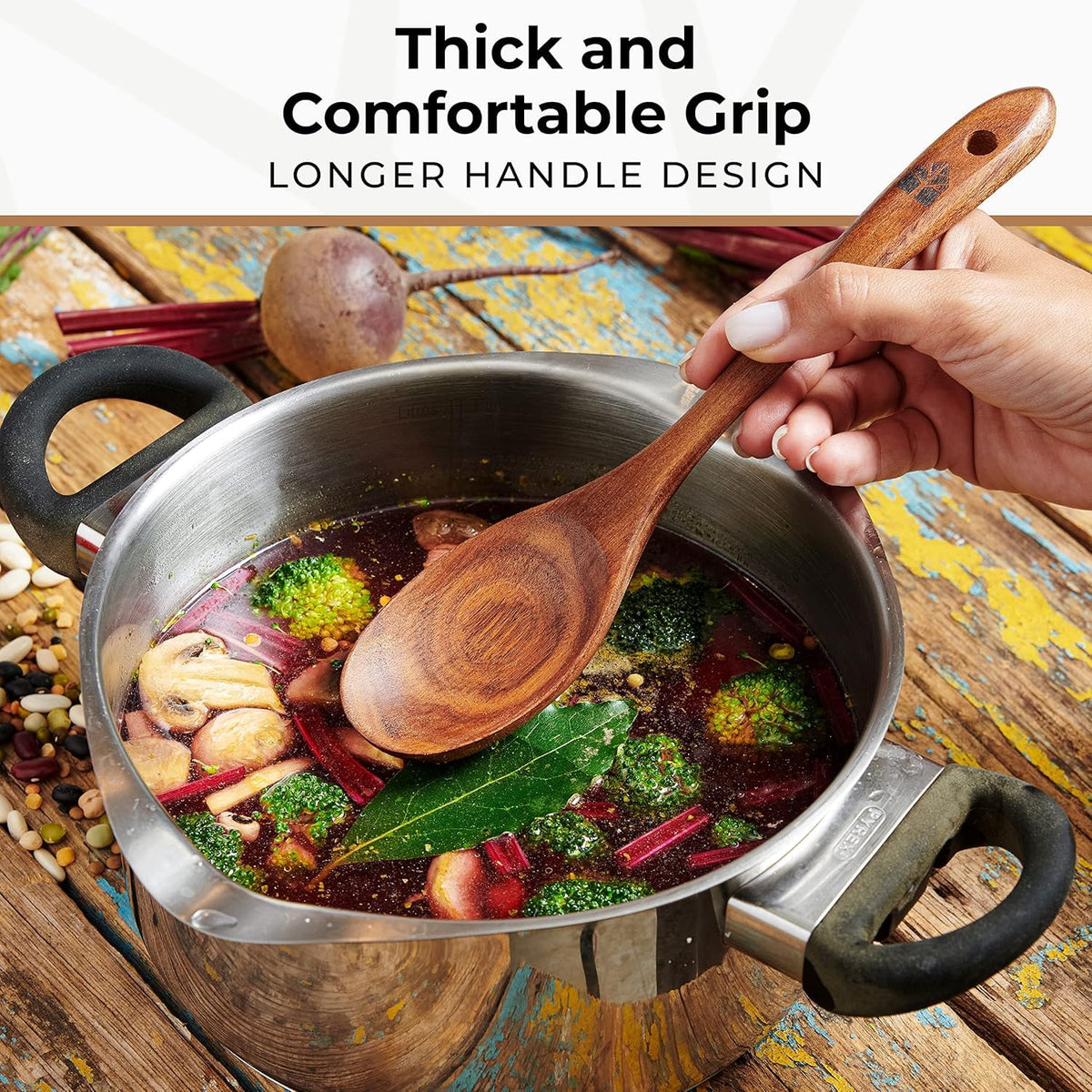 Woodenhouse teak serving spoon with smooth ergonomic grip.