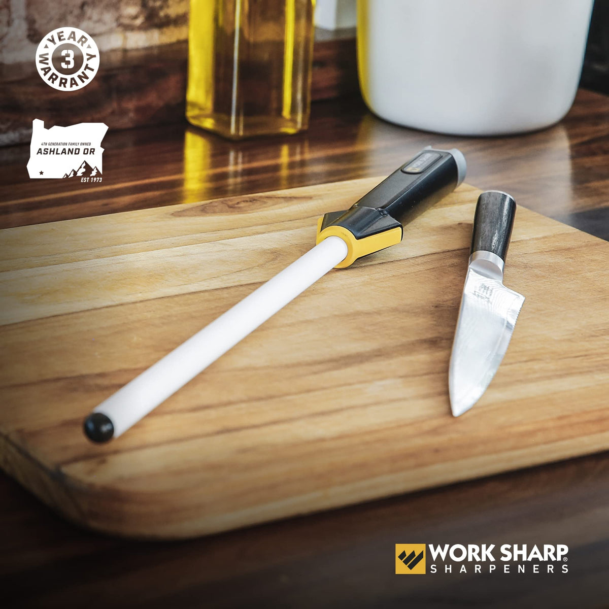 Close-up of the ceramic honing rod refining a chef knife edge.