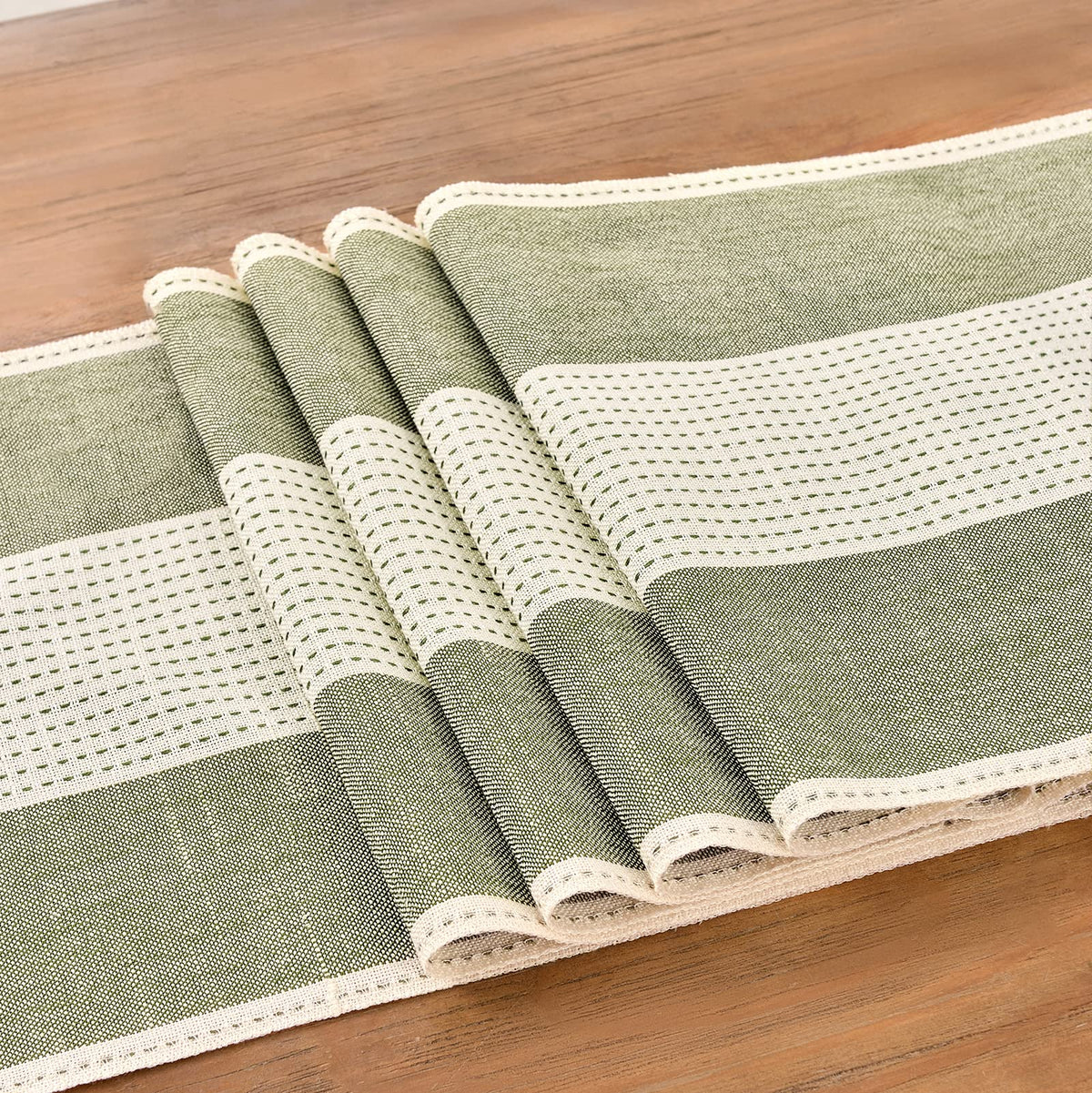 Close-up of Wracra linen runner macrame edges adding texture to a table