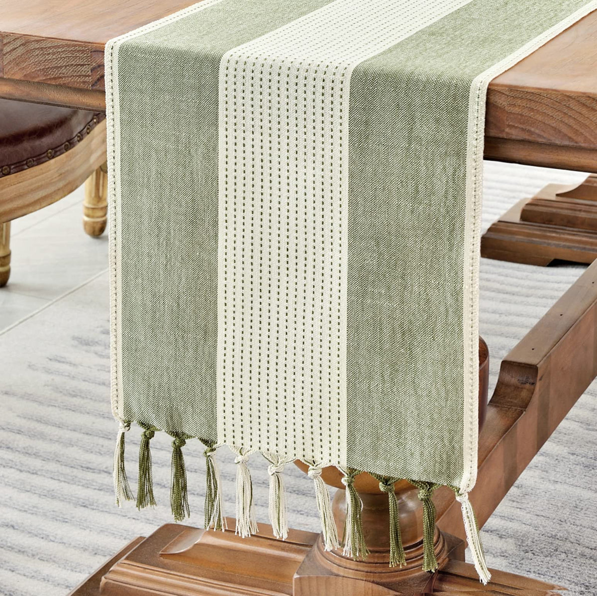 Wracra linen table runner in sage green with macrame fringe for rustic dining ambiance