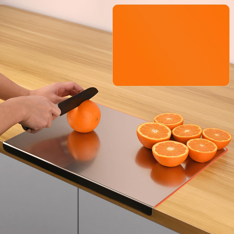 Wrbin large stainless steel cutting board with silicone mat on counter for stable prep.