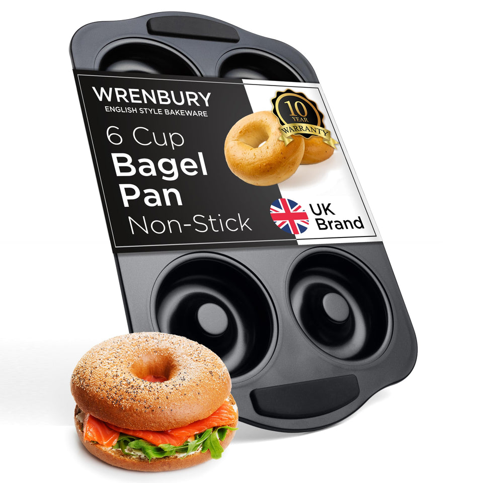Wrenbury Bagel Pan with silicone handles, six large donuts ready for baking.