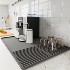 WUDIALIEN silicone coffee mat with raised edges protecting counters from spills and splashes