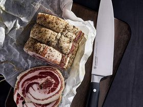 Wüsthof Classic IKON 8-Inch knife with double bolster showing balance and control.