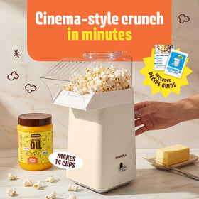 Wumple popcorn machine butter melting lid ready to drizzle melted butter on popcorn.