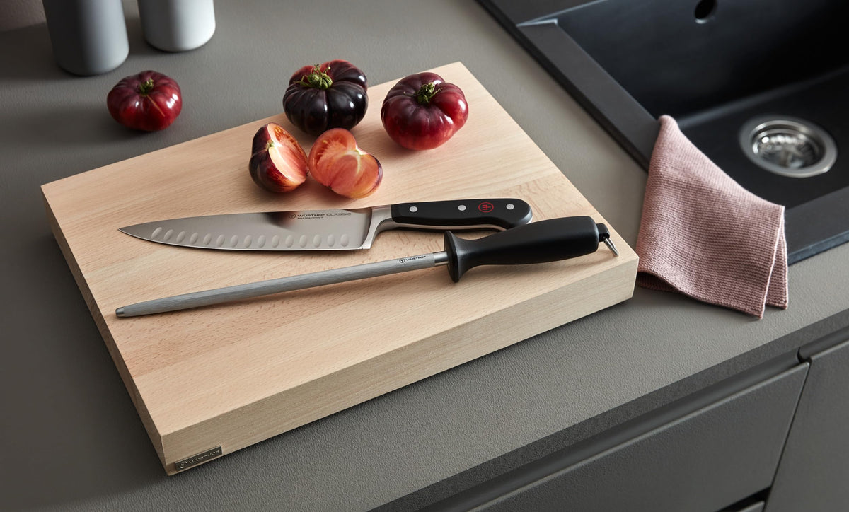 Wüsthof sharpening steel with non-slip handle enables safe, controlled honing.