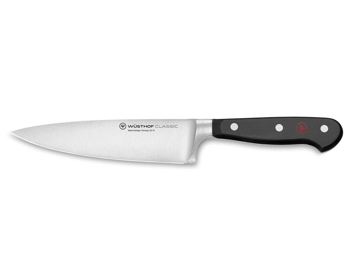 Wüsthof Classic 6-inch chef's knife blade close-up for precise slicing.