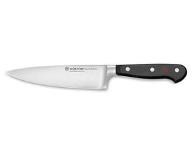 Wüsthof Classic 6-inch chef's knife blade close-up for precise slicing.