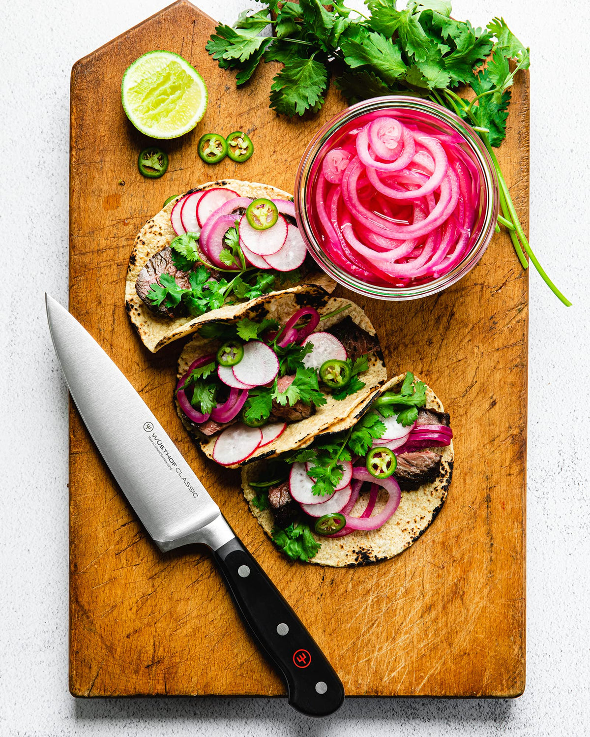 Wüsthof Classic knife in action for versatile kitchen prep.