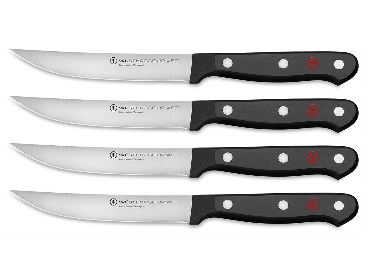 WÜSTHOF Gourmet 4-piece steak knife set with black handles for precise slicing.
