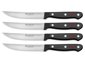WÜSTHOF Gourmet 4-piece steak knife set with black handles for precise slicing.
