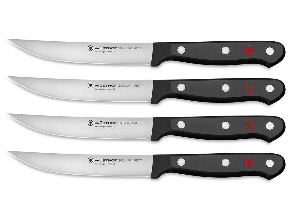 WÜSTHOF Gourmet 4-piece steak knife set with black handles for precise slicing.