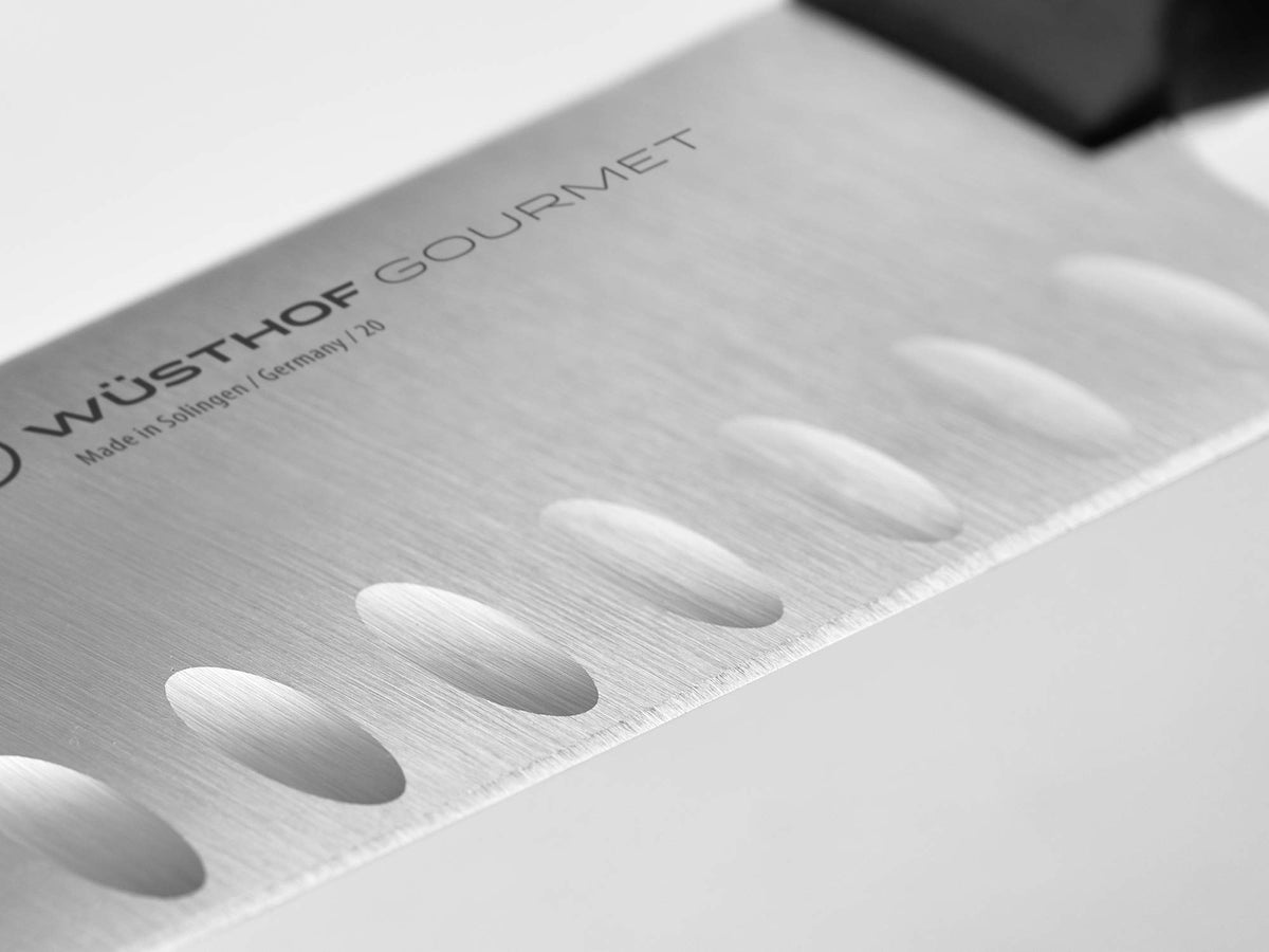 Wüsthof Gourmet 7-Inch santoku handle closeup shows durable synthetic grip.