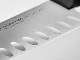 Wüsthof Gourmet 7-Inch santoku handle closeup shows durable synthetic grip.