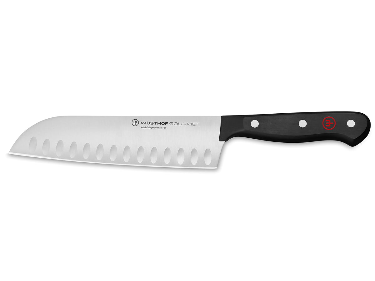 Wüsthof Gourmet 7-Inch hollow edge blade offers precise slicing with reduced sticking.