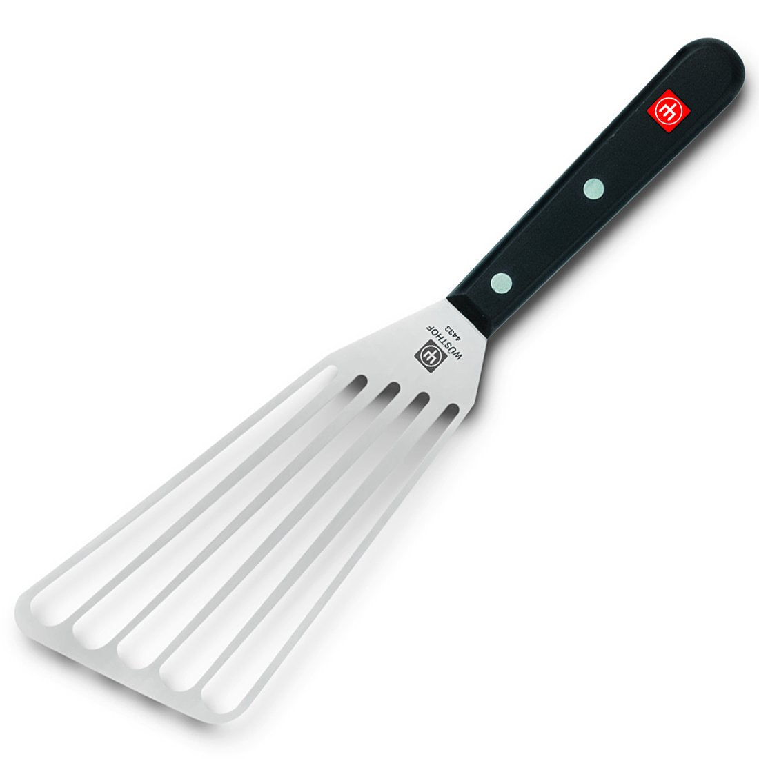WÜSTHOF Gourmet offset spatula in use enables efficient draining during sautéing.