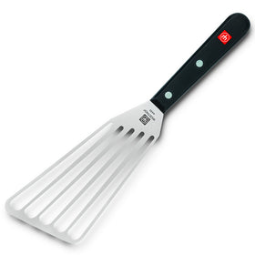 WÜSTHOF Gourmet offset spatula in use enables efficient draining during sautéing.