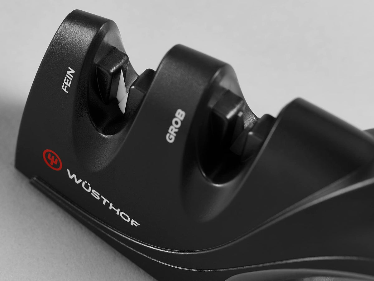 Wüsthof sharpener ergonomic-handle in-use delivers safe, controlled sharpening.