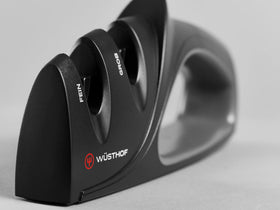 Wüsthof sharpener shown on non-slip base providing stability.