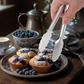 XEVOM plum-shaped tongs with anti-slip handles for grip.