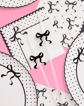 xo Fetti glitter clear straw with bow topper adds charm to beverages