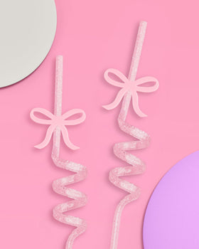 Removable bow charm on twisty straw with silver glitter for festive visuals