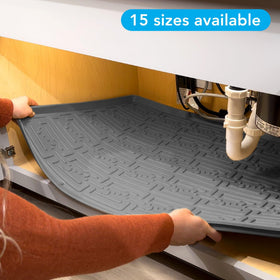 Beige driptray under sink catches drips and protects surfaces.