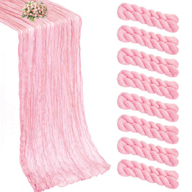 Xuehua pink cheesecloth table runner draped on a table for elegant dining ambiance