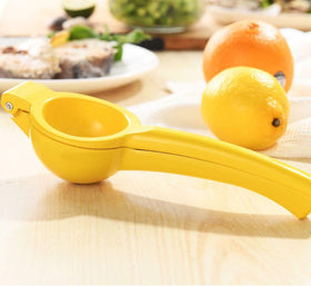 Y-Me compact storage handheld juicer fits neatly in a utensil drawer.