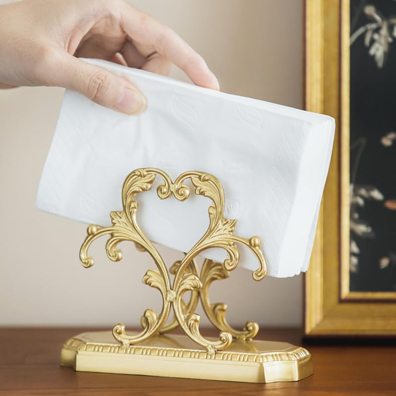 Brass napkin dispenser on kitchen counter with sturdy upright design