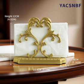 Gold brass napkin holder keeps napkins easily accessible on tabletop