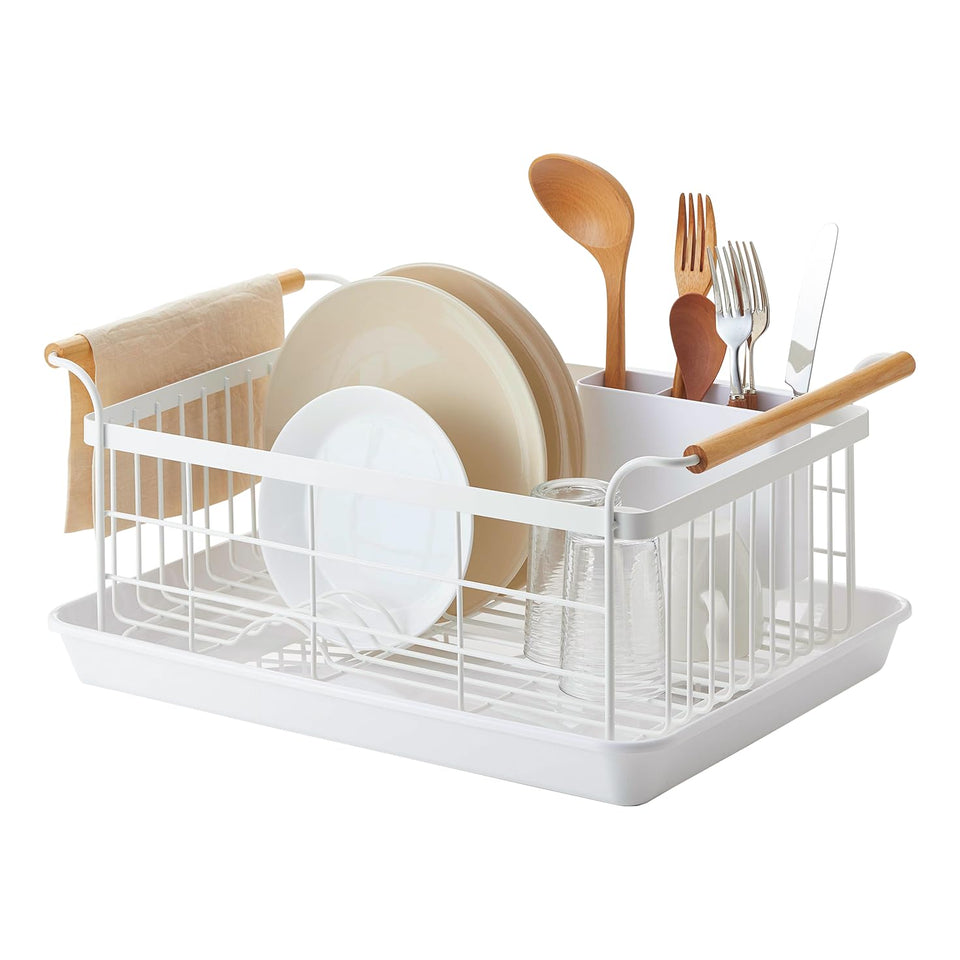 YAMAZAKI Home dish drying rack on counter with white steel and wood accents.