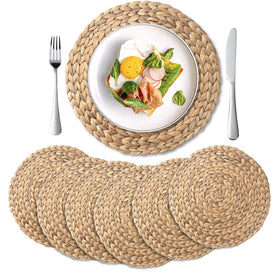 YANGQIHOME round woven placemats in natural water hyacinth protect surfaces with rustic charm.