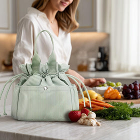 Yarnic lunch bag versatile as purse or casual tote with green stripes.