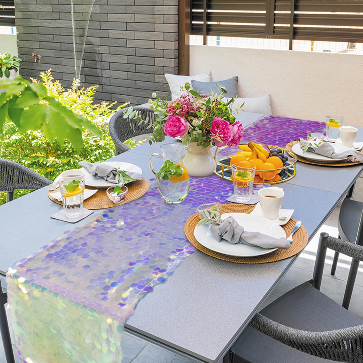 Yblut ocean party decor accents the table with mermaid-scale shimmer on a long runner.